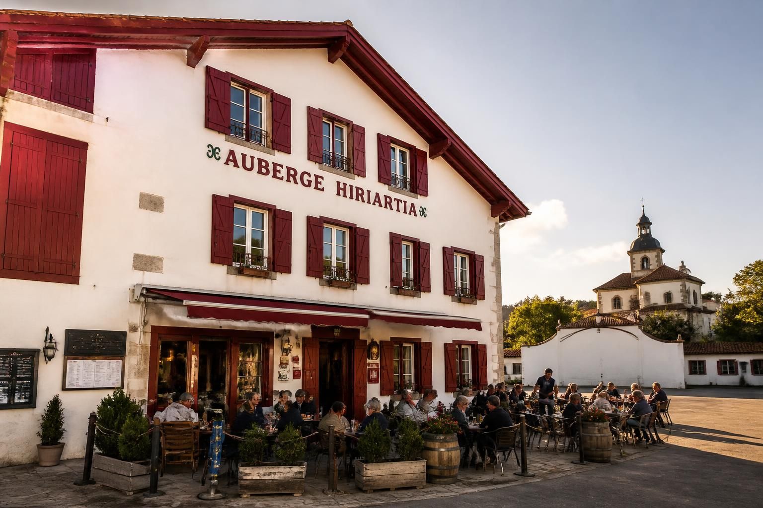 découvrez l'auberge hiriartia à ahetze au cœur du pays basque, qui entame une nouvelle ère alliant tradition et modernité pour une expérience authentique.